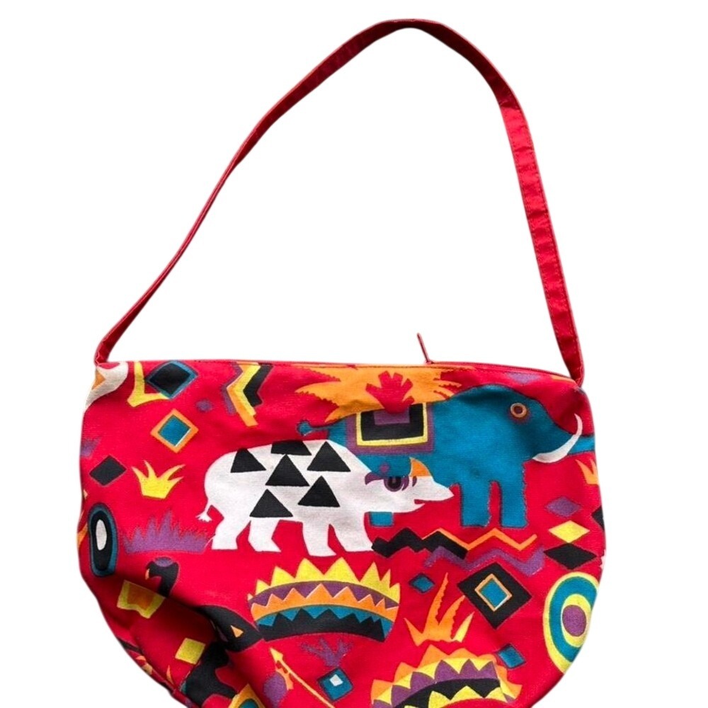 Red canvas bag with colorful animal print